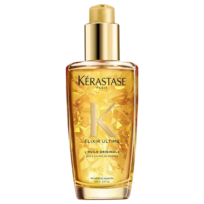 Frasco de óleo capilar Kérastase Elixir Ultime, com embalagem dourada e brilhante, apresentando o logotipo da marca e o nome do produto em destaque.