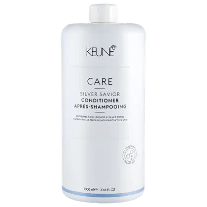Frasco branco da linha Care da Keune, contendo condicionador Silver Savior para tons loiros e prateados. O rótulo apresenta o nome da marca e do produto em letras pretas.