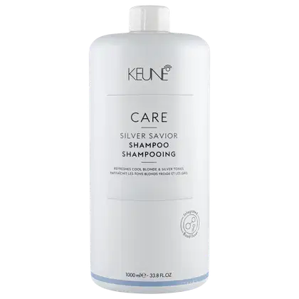 Frasco branco da linha Care da Keune, contendo Shampoo Silver Savior, que promete refrescar e tonalizar tons loiros e grisalhos.