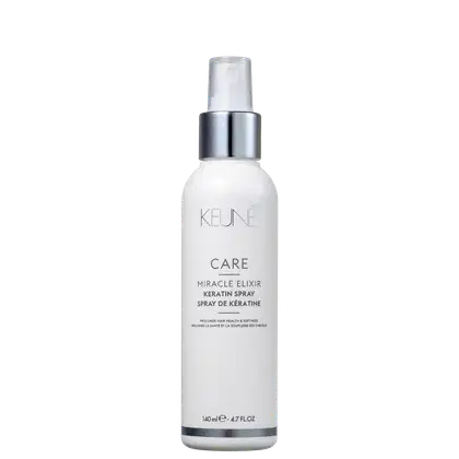 A imagem mostra um produto da marca Keune. É um spray de queratina chamado "Miracle Elixir Keratin Spray". O frasco tem um design simples, com o corpo branco e a tampa prateada. A embalagem está escrita em inglês e detalha que benefícios do produto.