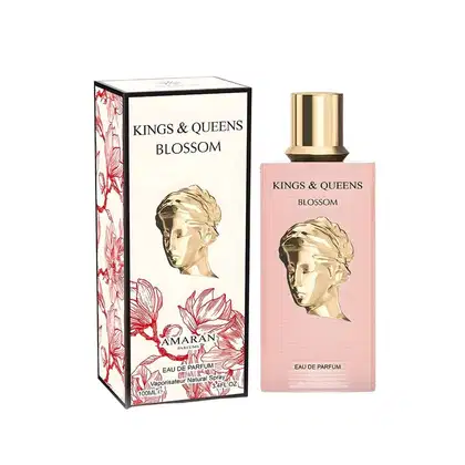 Frasco de perfume da linha Kings & Queens da marca Amaran Parfums, com embalagem rosa e dourada contendo o nome "Blossom" e uma imagem de uma escultura feminina.