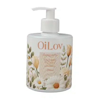 Frasco de sabonete líquido OiLov com design floral, contendo 350ml do produto "Vale das Flores". Embalagem branca com ilustrações de flores e folhas em tons de amarelo e verde.