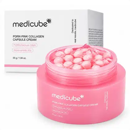 Medicube PDRN Pink Collagen Capsule Cream em embalagem rosa com cápsulas rosas em seu interior. Contém PDRN (Sodium DNA) e Niacinamida 5% como ingredientes, com peso líquido de 55g/1.94 oz.