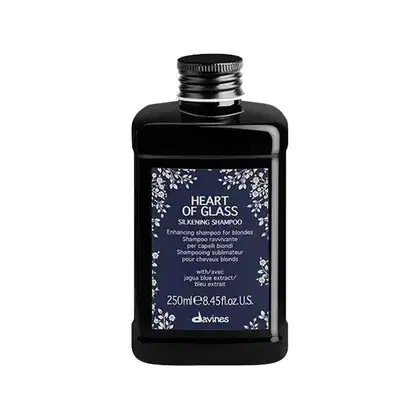 Frasco preto de 250ml do shampoo "Heart of Glass" da marca Davines, com rótulo azul-marinho com flores brancas, indicado para cabelos loiros.