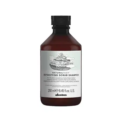 Frasco de shampoo esfoliante detoxificante da marca Naturaltech da Davines, com 250 ml de capacidade. O rótulo apresenta uma ilustração estilizada e texto descritivo do produto.
