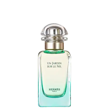 Frasco de perfume Hermès "Un Jardin sur le Nil", com design elegante em vidro e metal, rótulo em letras brancas sobre fundo verde claro, evocando uma fragrância fresca e natural.