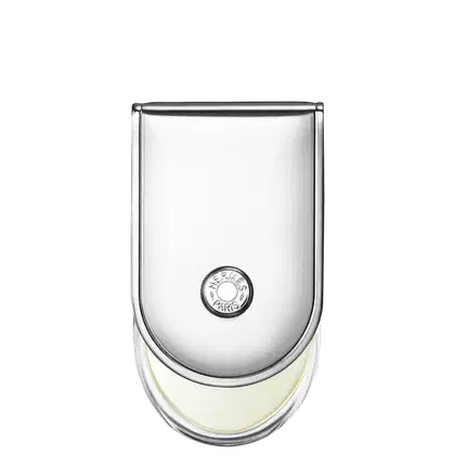 Frasco de perfume Hermès em vidro transparente com tampa arredondada. Rótulo circular com a marca Hermès Paris impresso em preto. Líquido incolor visível no interior do frasco.