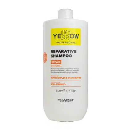 Frasco branco de shampoo reparador da marca Yellow Professional, com rótulo amarelo destacando a fórmula reparadora e os ingredientes de bond complex e manteiga de cacau.