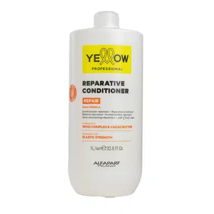 Frasco branco de condicionador reparador da linha Yellow Professional, com rótulo amarelo destacando o nome da marca e a fórmula "Reparative Conditioner" para fortalecimento dos cabelos.