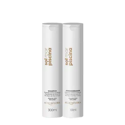 Dois frascos brancos de 300ml da linha Acquaflora, contendo shampoo e condicionador para cabelos. Os rótulos apresentam o nome da marca e indicam que os produtos são à base de água de coco.