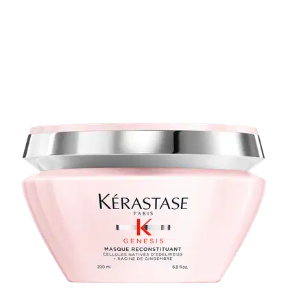 Frasco rosa de 200 ml da máscara Reconstituant Kérastase Genesis, com rótulo destacando os ingredientes ativos de células nativas de edelweiss e raiz de gengibre.
