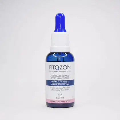 Frasco de plástico branco e azul com rótulo "FITOZON - Phytotherapy Medicinal Ozone" e informações sobre o produto, um cuidado íntimo com efeito afrodisíaco, testado dermatologicamente, ginecologicamente e clinicamente.
