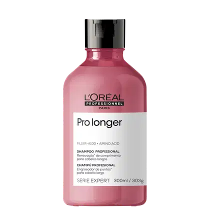 Shampoo da linha Serie Expert Pro longer da L'Oréal Professionnel. O frasco é de plástico rosa. Na parte frontal, há um rótulo branco com o nome do produto "Pro longer" e a descrição "Filler-A100 + Amino Acid Shampoo Profissional" em português e inglês.
