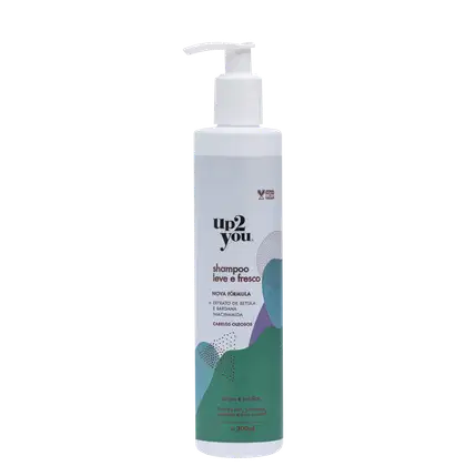 Embalagem plástica branca opaca com bomba dosadora. Rótulo com texto em preto e detalhes gráficos em tons de verde e azul. Capacidade de 300ml.