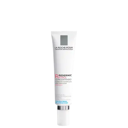 Embalagem em tubo plástico branco com detalhes em cinza e vermelho. Rótulo indica que é um "Redermic Retinol Concentrado", um corretivo antirrugas uniformizador intensivo.
