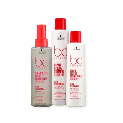 Três produtos da linha Bonacure da Schwarzkopf Professional: um spray condicionador, um shampoo e um condicionador de reparo, todos em embalagens brancas e vermelhas.