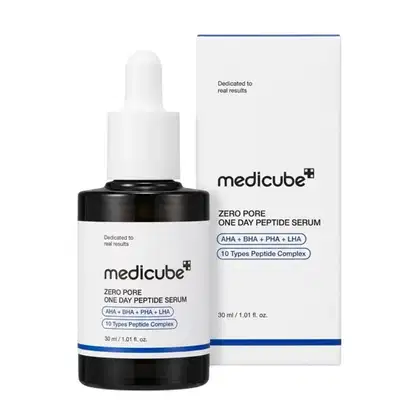 Medicube Zero Pore One Day Peptide Serum em frasco preto com conta-gotas e caixa branca com detalhes em azul. Produto com 10 tipos de peptídeos e ingredientes AHA, BHA, PHA e LHA, dedicado a resultados reais.