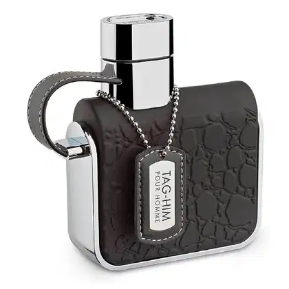 Frasco de perfume masculino com design moderno e elegante, em tons de preto e prata, com etiqueta de identificação "Tag-him" na embalagem.
