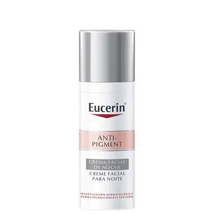 Frasco de creme facial noturno da linha Anti-Pigment da Eucerin, com embalagem branca e prata, contendo informações sobre o produto em inglês e espanhol.