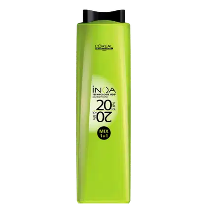 Frasco de produto de coloração de cabelos da marca L'Oréal, na cor verde-limão, com rótulo indicando a tecnologia "INOA" e o volume de 20 volumes. O produto é apresentado em embalagem plástica com design moderno e contrastante.