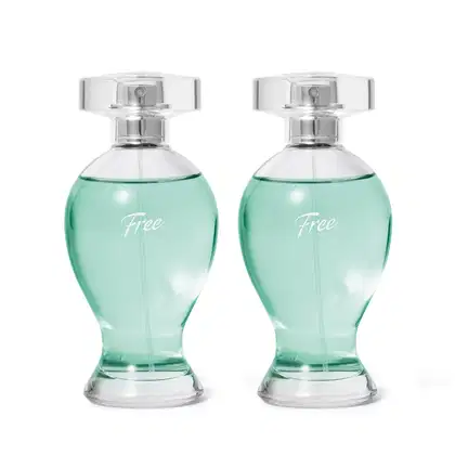 São dois frascos de perfume da linha Free. Os frascos têm um design arredondado e alongado, feitos de vidro transparente com um líquido de cor verde água.