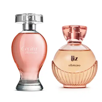 Imagem de dois desodorantes colônia femininos, sendo um vidro em formato curvilíneo transparente com líquido rosa e borrifador prateado das marca Cecita Blossom e um vidro arredondado com  líqudio bege e borrifador dourado da marca Liz.