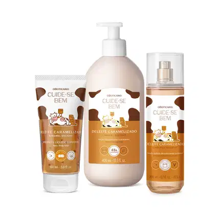 A imagem mostra três produtos da linha Cuide-se Bem Caramelizado: bisnaga de sabonete líquido, frasco de loção hidratante e body splash em spray. Todas as embalagens são brancas com tons de marrom, ilustração de vaca e detalhes em preto.