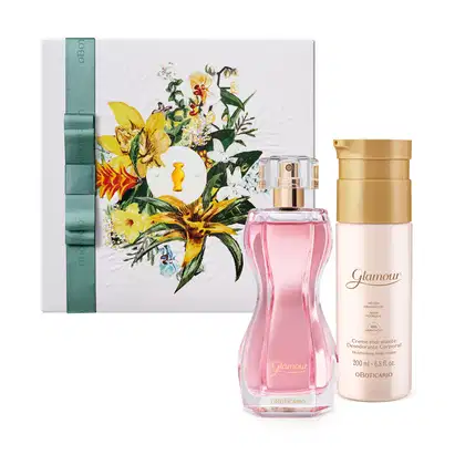 Caixa branca com flores coloridas, frasco de perfume rosa com rótulo "Glamour", e frasco de creme hidratante dourado com rótulo "Glamour" e "Creme Hidratante Desodorante Corporal".