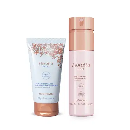 A imagem mostra dois produtos da marca Floratta: um frasco de body splash Floratta Rose, branco com tampa e rótulo dourados e uma bisnaga de creme corporal Floratta Blue, com embalagem branca, flores douradas e letras em tons de dourado e azul.