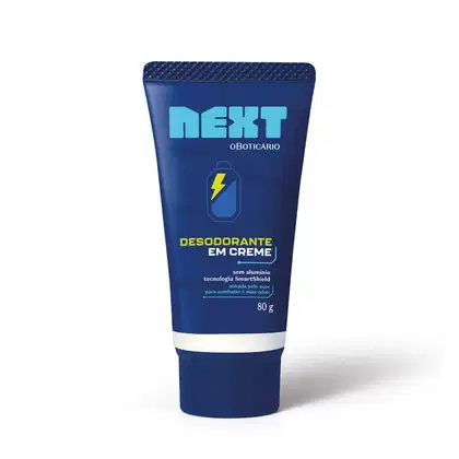 Embalagem azul escura de desodorante em creme da marca Next, com tecnologia SmartShield e sem alumínio, com detalhes em sobretom de azul um pouco mais claro e um ícone de bateria com um raio amarelo dentro.
