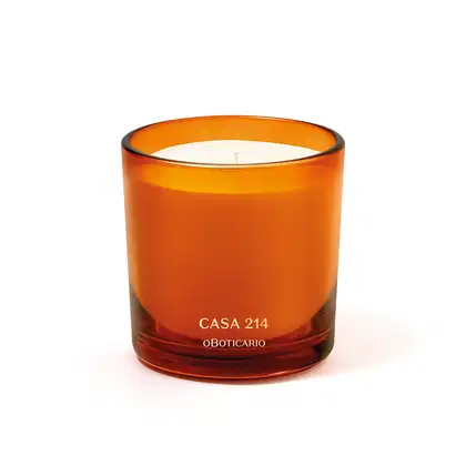 Vela perfumada em recipiente de vidro na cor laranja com letras douradas da marca Casa 214 Vanilla Sublime.