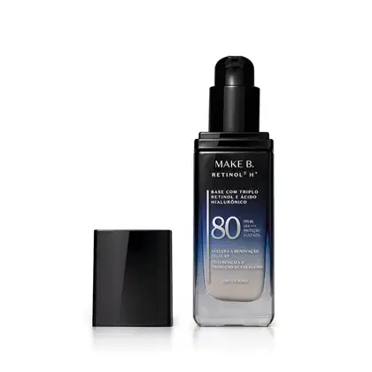 Frasco de vidro retangular aberto em degradê de preto para o azul base líquida da marca Make B.  Retinol 3 H+, na parte inferior se vê o tom claro da base. O rótulo contém texto escrito em branco, com destaque para o FPS 80. Tampa preta ao lado do frasco