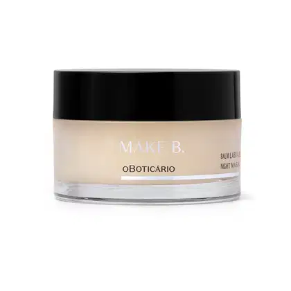 Pote de balm labial noturno da marca Make B. Lip Chronology Night Mask. O recipiente é redondo, com uma tampa preta e o rótulo exibe o nome da marca em letras brancas. Há detalhes branco na embalagem.