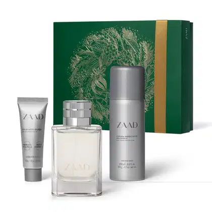 Imagem do Kit Presente Natal Zaad com um vidro transparente com tampa prateada de desodorante colônia, um frasco prata de espuma de barbear, uma bisnaga de balm pós-barba e uma caixa presenteável verde com ilustração natalina.
