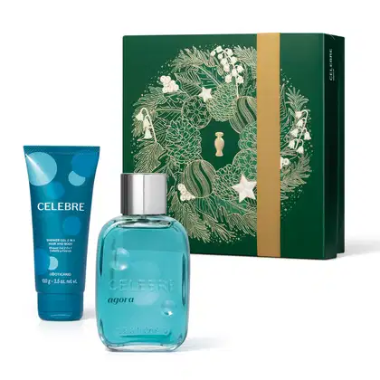 Imagem do Kit Presente Natal Celebre Agora Masculino com um vidro transparente com líquido azul e tampa prateada de desodorante colônia, uma bisnaga azul de shower gel e uma caixa presenteável verde com estampa natalina.