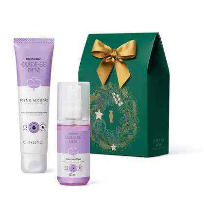 Conjunto de produtos de beleza da marca Cuide-se Bem, incluindo um desodorante hidratante em tubo de 100 ml na cor lilás e um frasco de 60 ml do mesmo produto, embalados em uma caixa verde com laço dourado e decoração floral.