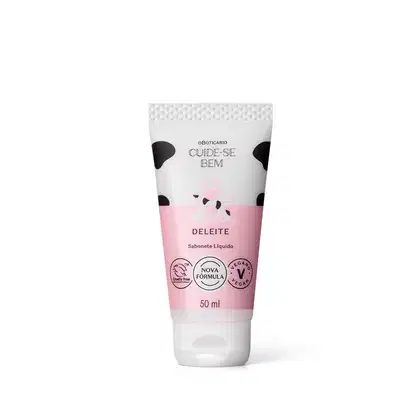 Imagem de tubo de sabonete líquido em embalagem branca e rosa com rótulo "Cuide-se Bem Deleite"em letras pretas e ilustrações de vaca ilustrando. Sugere um produto de fragrância doce e aconchegante.