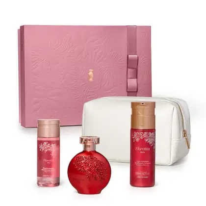 Caixa de presente rosa, nécessaire branco e três produtos da marca Floratta Red, sendo um frasco de óleo perfumado corporal, vidro de desodorante colônia e embalagem de loção hidratante corporal, todos em cor vermelha com detalhes dourados.