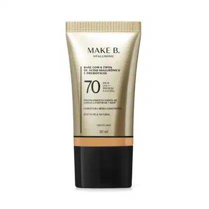Frasco de base com 8 tipos de ácido hialurônico e probióticos da marca Make B., com FPS 70, UVA+++ e proteção à luz azul. Embalagem em tons de bege e preto, com informações sobre o produto.