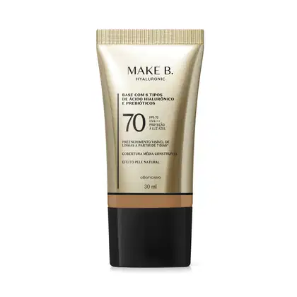 Frasco de base com 8 tipos de ácido hialurônico e probióticos da marca Make B., com FPS 70, UVA+++ e proteção à luz azul. Embalagem em tons de bege e preto, com informações sobre o produto.