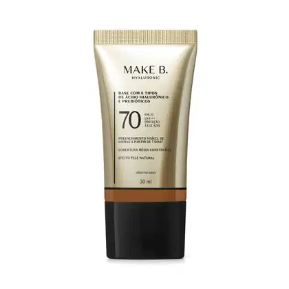 Frasco de base com 8 tipos de ácido hialurônico e probióticos da marca Make B., com FPS 70, UVA+++ e proteção à luz azul. Embalagem em tons de bege e preto, com informações sobre o produto.