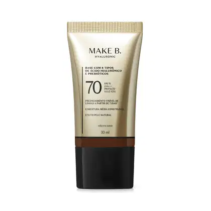Frasco de base com 8 tipos de ácido hialurônico e probióticos da marca Make B., com FPS 70, UVA+++ e proteção à luz azul. Embalagem em tons de bege e preto, com informações sobre o produto.