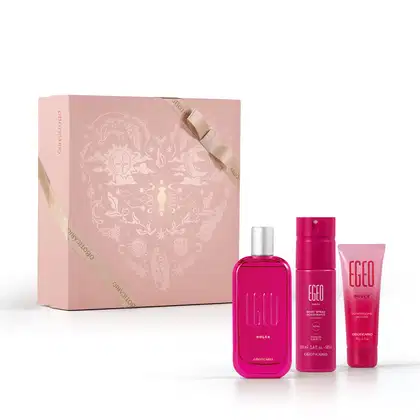 Caixa rosa claro com padrão floral em dourado e três itens de perfumaria da marca Egeo Dolce, sendo: frasco de desodorante colônia, tubo de body spray e bisnaga de creme hidratante desodorante, todos na cor pink.