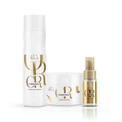A imagem mostra três produtos da linha Oil Reflections de Wella. O 1º é um shampoo em uma embalagem branca. O 2º é uma máscara em um pote branco, ambos com detalhes em dourado. O terceiro produto é um óleo de brilho em um frasco pequeno dourado.