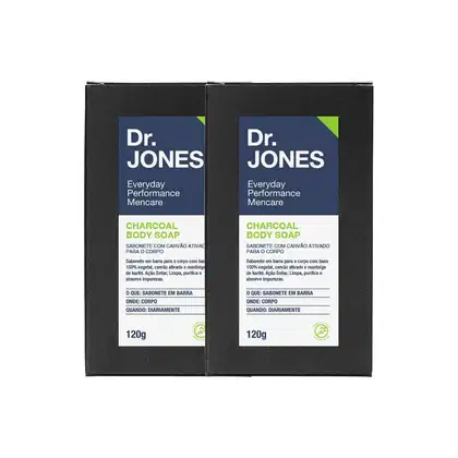 A imagem mostra dois sabonetes corporais Dr. Jones. Os sabonetes são pretos, são feitos de carvão ativado e possuem uma embalagem azul e verde de 120g.