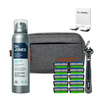 Conjunto de produtos de barbear da marca Dr. Jones, incluindo um frasco de espuma de barbear, uma lâmina de barbear com vários cartuchos de reposição e um suporte de metal com o nome da marca.