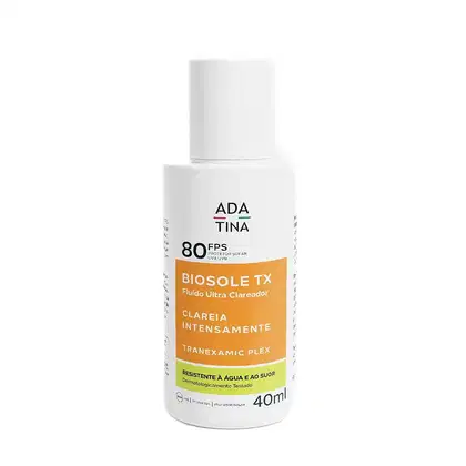 Frasco branco de protetor solar Biosole TX da marca Adatina, com FPS 80 e rótulo destacando a fórmula "Fluido Ultra Clareador" e "Clareia Intensamente". O produto apresenta embalagem cilíndrica simples e contém 40ml.