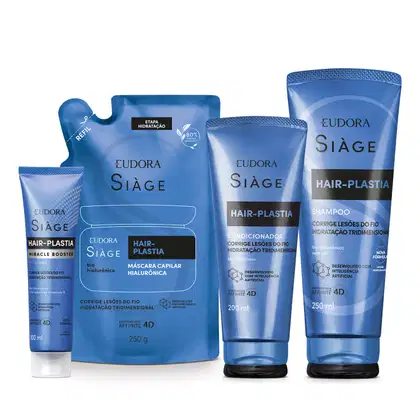 A imagem mostra um kit com quatro produtos, uma bisnaga pequena de tratamento capilar, um refil de máscara capilar, uma bisnaga de condicionador e outra de shampoo. Todos com embalagem azul, letras brancas e pretas no rótulo.