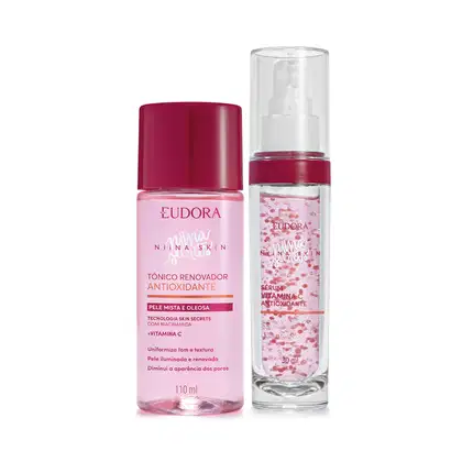 A imagem mostra um kit com dois frascos plástico, de frente, um redondo e outro cilíndrico. O redondo é todo rosa claro transparente com tampa rosa e o cilíndrico é branco transparente  com tampa transparente.