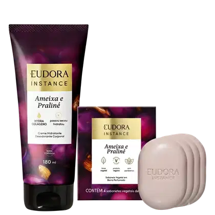O produto de beleza Instance da Eudora consiste em um creme hidratante corporal em embalagem de 180 ml com rótulo roxo e dourado, além de 4 sabonetes vegetais em barra perfumada.